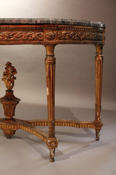 Half-moon console in carved and gilded wood...