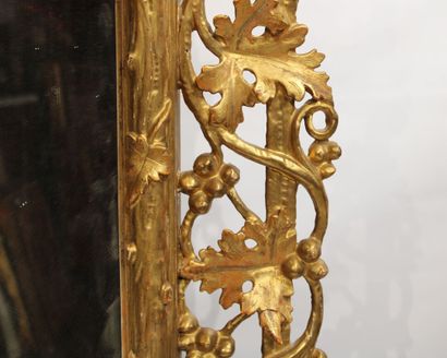 Louis XVI style mirror in carved and gilded...