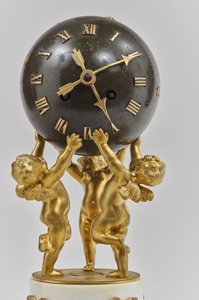 Louis XVI style starry globe clock supported...