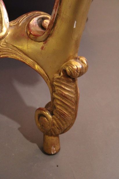 Transition style console in carved and gilded...