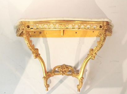 Transition style console in carved and gilded...