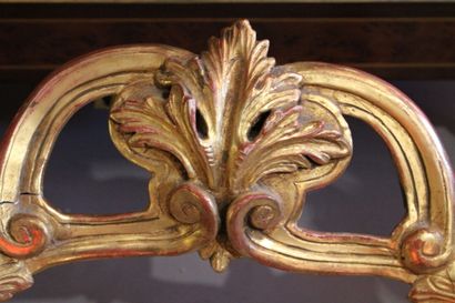 Transition style console in carved and gilded...