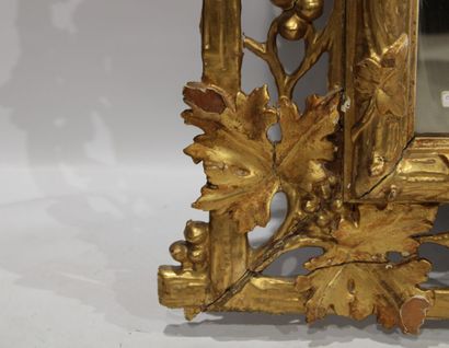 Louis XVI style mirror in carved and gilded...