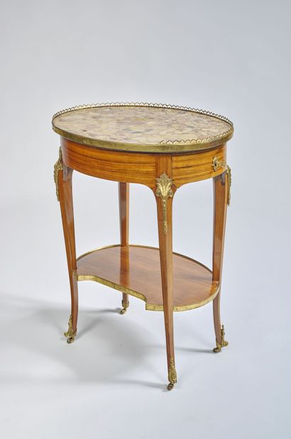 Elegant flying table of oval shape decorated...