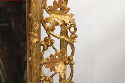 Louis XVI style mirror in carved and gilded...