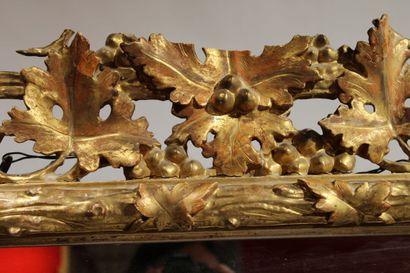 Louis XVI style mirror in carved and gilded...
