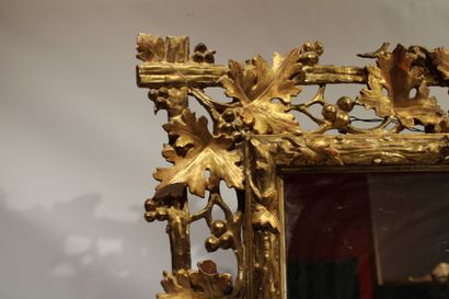 Louis XVI style mirror in carved and gilded...
