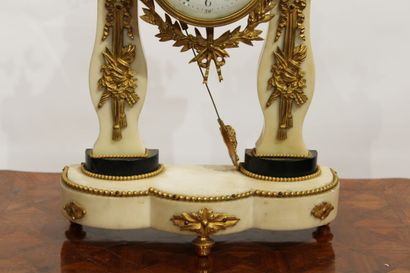 A Louis XVI style portico clock in white...