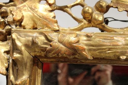 Louis XVI style mirror in carved and gilded...