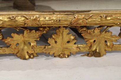 Louis XVI style mirror in carved and gilded...