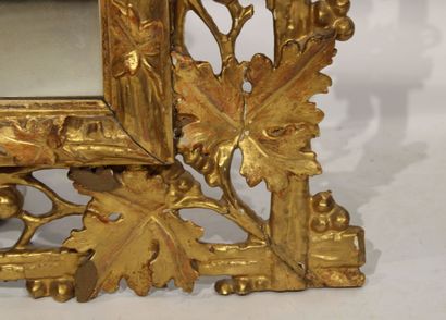Louis XVI style mirror in carved and gilded...
