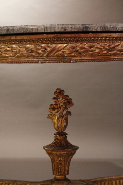 Half-moon console in carved and gilded wood...