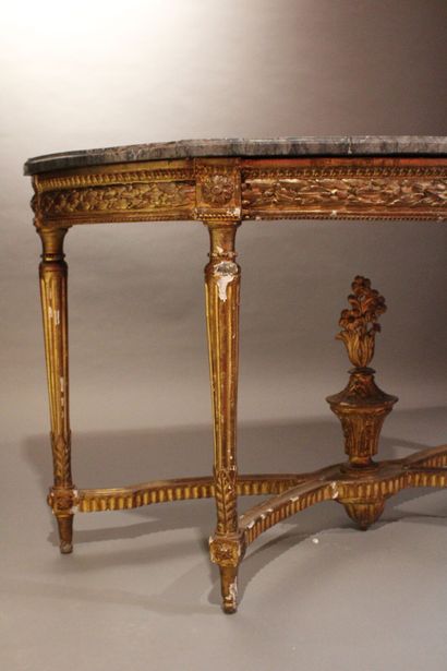 Half-moon console in carved and gilded wood...