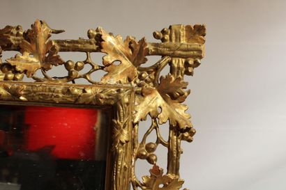 Louis XVI style mirror in carved and gilded...