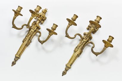 Pair of Louis XVI style sconces in chased...