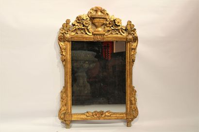 Louis XVI period mirror in carved and gilded...