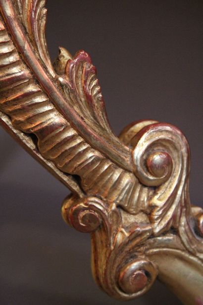 Transition style console in carved and gilded...