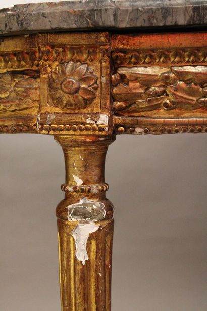 Half-moon console in carved and gilded wood...