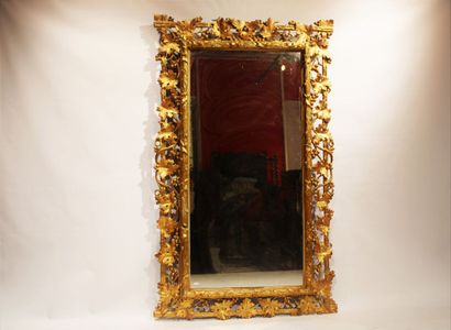 Louis XVI style mirror in carved and gilded...