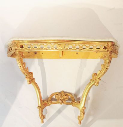 Transition style console in carved and gilded...