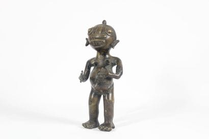 AFRICA. 
Divinity in patinated bronze. Mid...