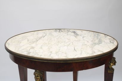 Gueridon in burr wood, ormolu trim decorated...