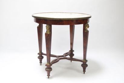 Gueridon in burr wood, ormolu trim decorated...