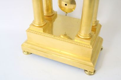 Gilt bronze portico clock with flower and...