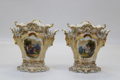 Pair of Paris porcelain vases, each resting...