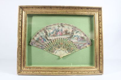 Bone fan with painted scenes of gallantry....