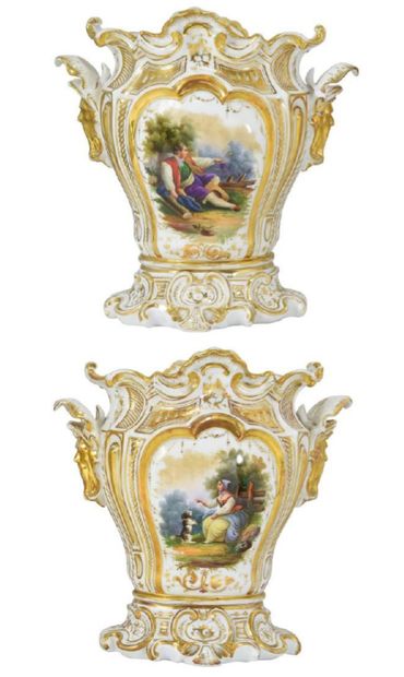 Pair of Paris porcelain vases, each resting...