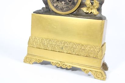Gilt bronze and patinated clock decorated...
