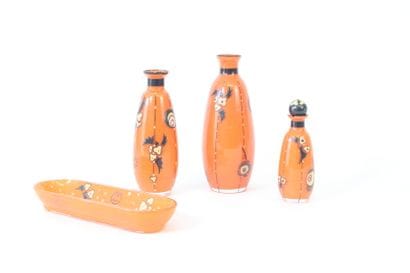 DELATTE Nancy.
Toilet set in orange-tinted...