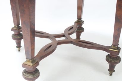 Gueridon in burr wood, ormolu trim decorated...
