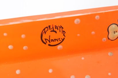 DELATTE Nancy.
Toilet set in orange-tinted...