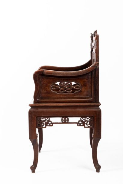 Natural wood armchair with straight, carved...