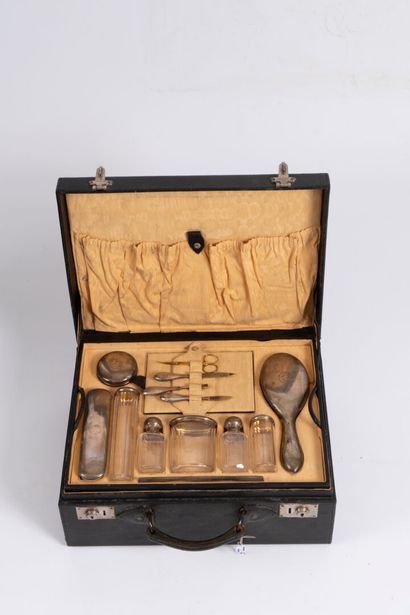 Leather case containing a silver-plated monogrammed...