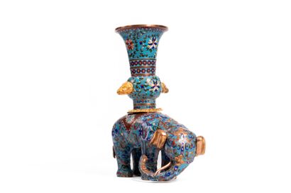 CHINA. 
Large elephant supporting a Gu vase,...