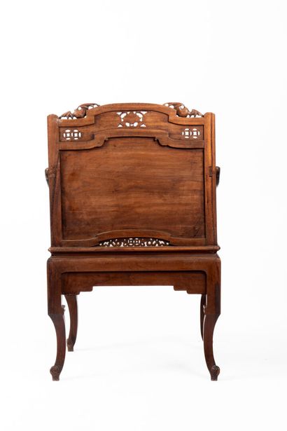 Natural wood armchair with straight, carved...
