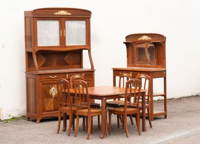 Wooden dining room with ormolu trim, comprising...
