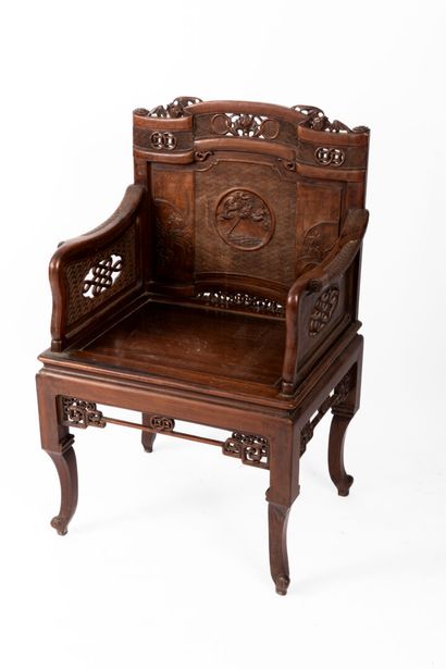 Natural wood armchair with straight, carved...