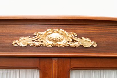 Wooden dining room with ormolu trim, comprising...