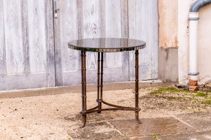 Large tripod pedestal table in gilded metal...