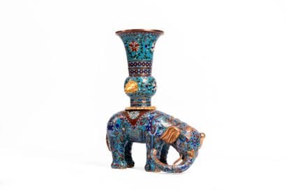 CHINA. 
Large elephant supporting a Gu vase,...