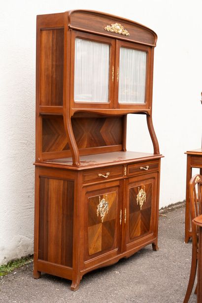 Wooden dining room with ormolu trim, comprising...