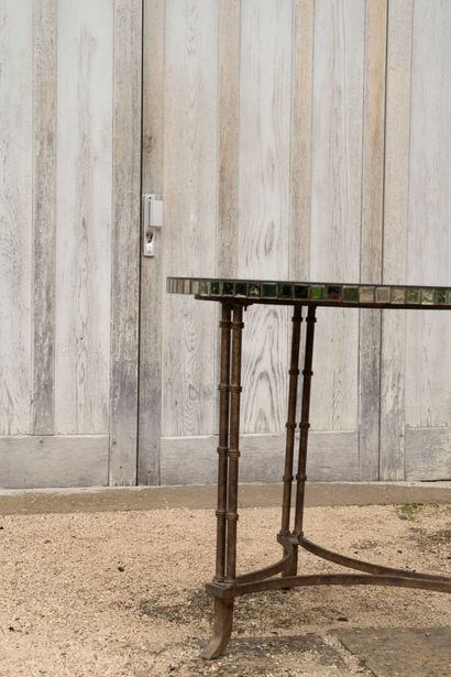 Large tripod pedestal table in gilded metal...