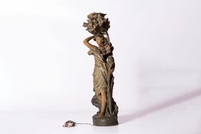 Large patinated terracotta lamp depicting...