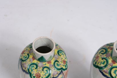 CHINA.
Pair of covered pots in green family...
