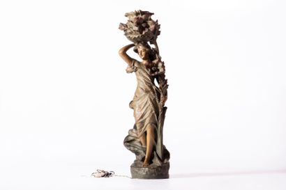 Large patinated terracotta lamp depicting...
