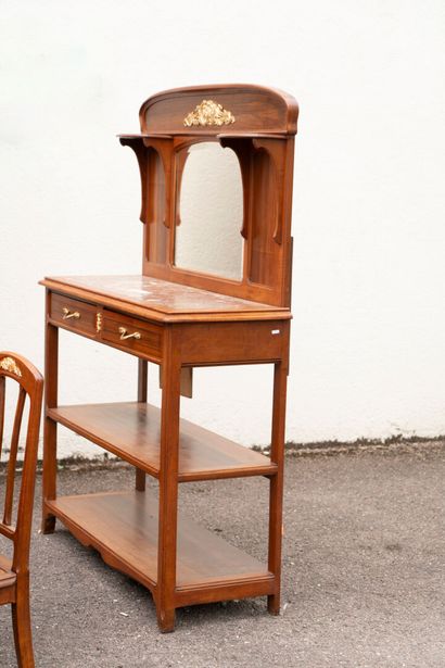 Wooden dining room with ormolu trim, comprising...